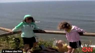 Ecola State Park, Oregon. Alaina Pitton falls over a low fence rail in this still from home video. Right behind her is a 150-foot cliff.