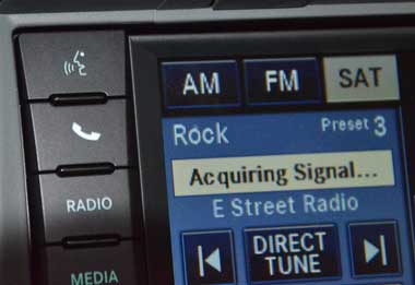 Close up of voice activation and phone buttons on my Chrysler vehicle.  Photo by Glen Green.